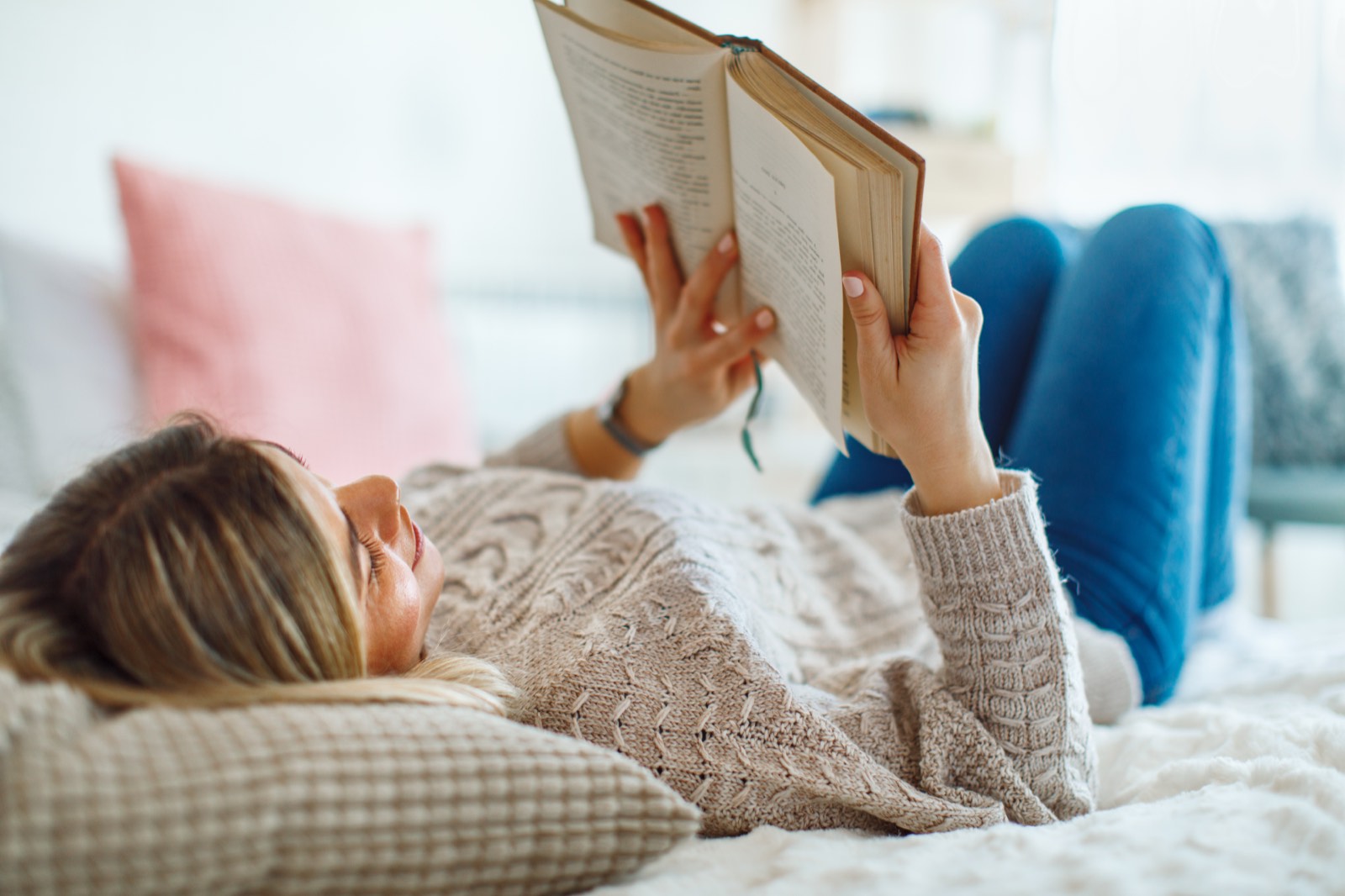 Morning light falling across an open book near a window